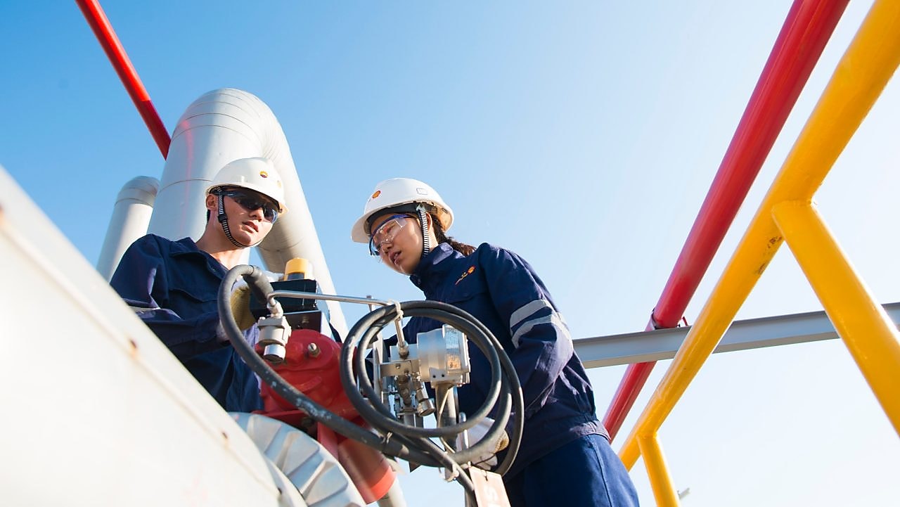 Two engineers working on volve.