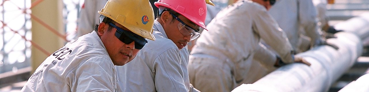 Shell workers moving catalyst equipment