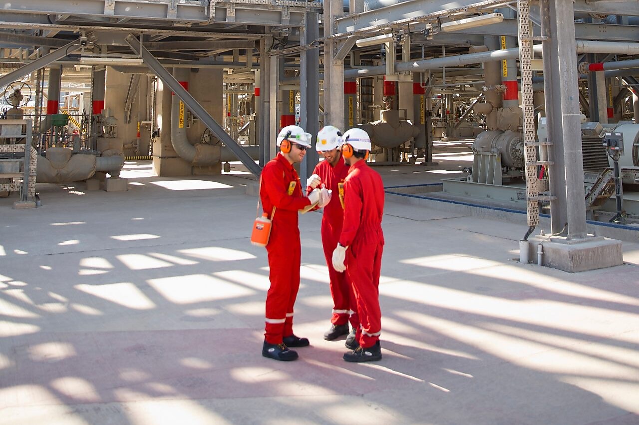 three workers having a discussion