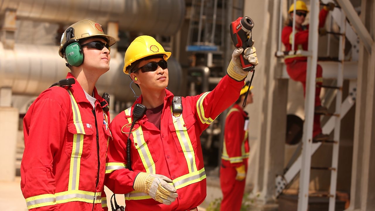 Workers observe custom catalyst development efforts