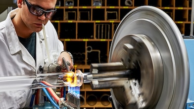 Workers observe custom catalyst development efforts