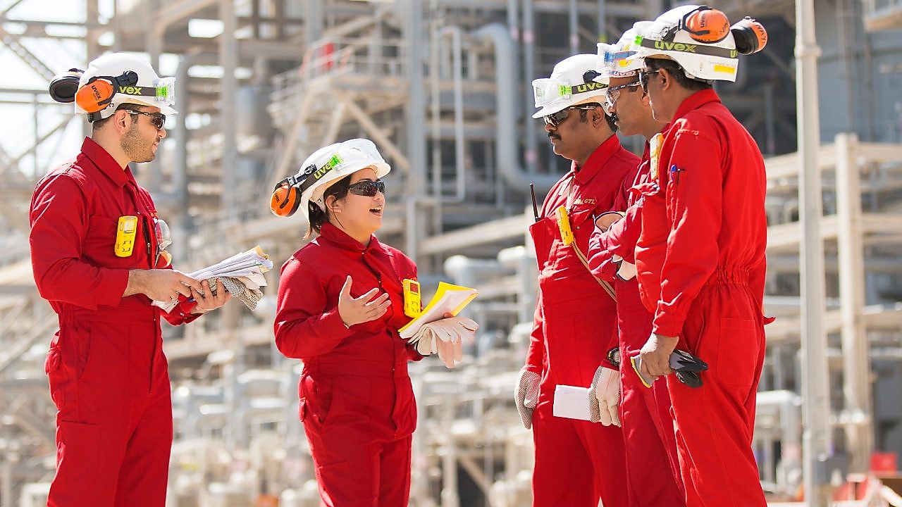 Onsite technicians have a tool box talk at the Base Oil Re-distillation Unit.