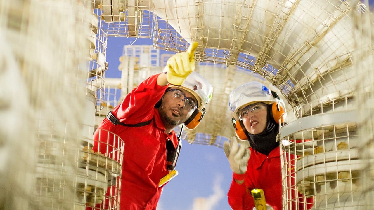 Maintenance Operator and Technologist inspecting relief valve for distillate hydrotreating.