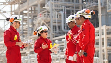 onsite technicians have a tool box talk at the base oil re distillation unit