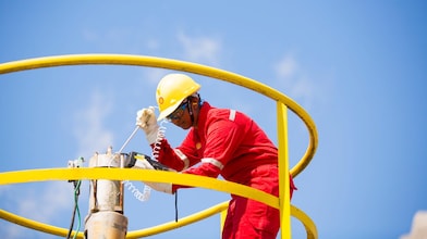 Supervisor checks the well bay while leveraging residue upgrading catalysts.