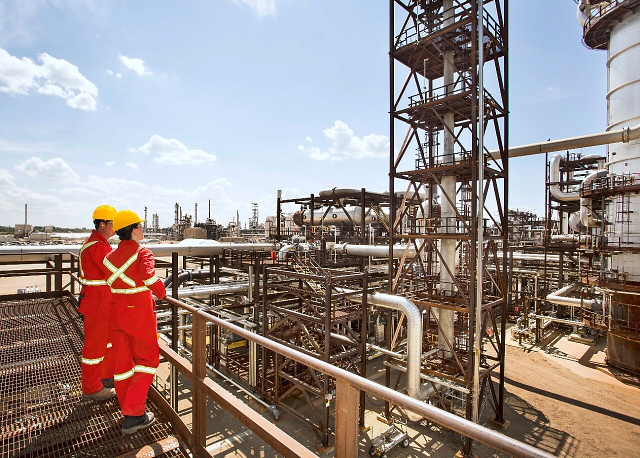 Workers survey a portion of the Quest unit at the Scotford Upgrader