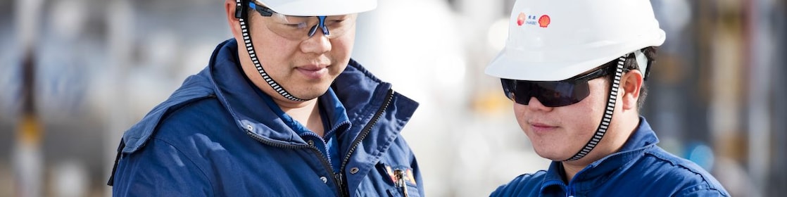 Shell employees reviewing documents