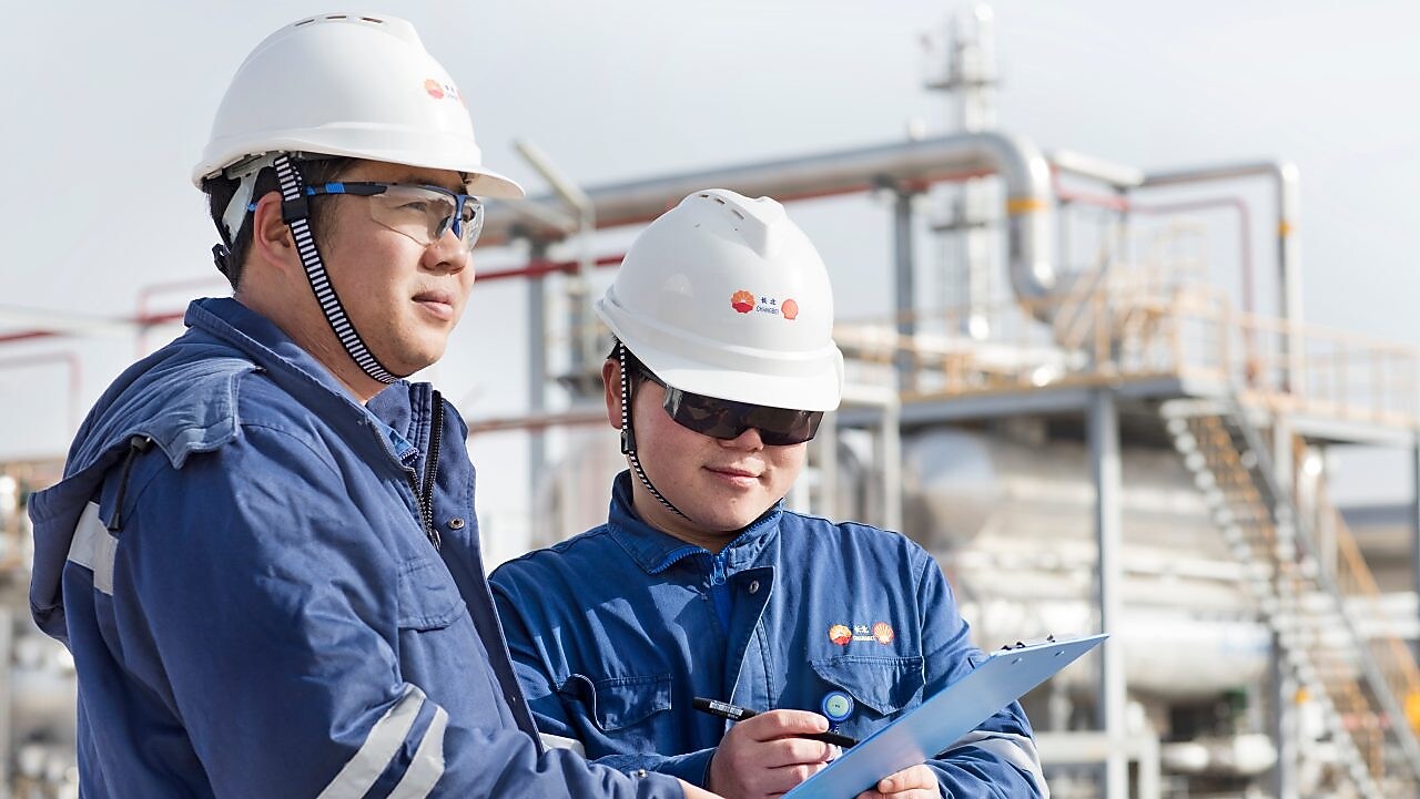 Refinery employees review emissions standards