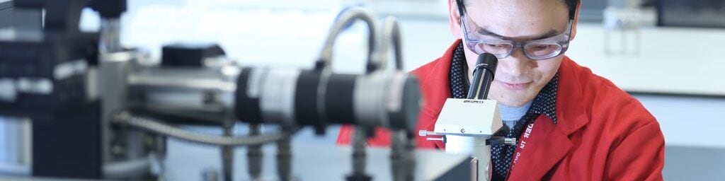 Shell employee revieiwing emissions standards in a lab