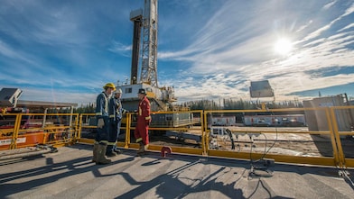 Shell gas processing three shell employee working