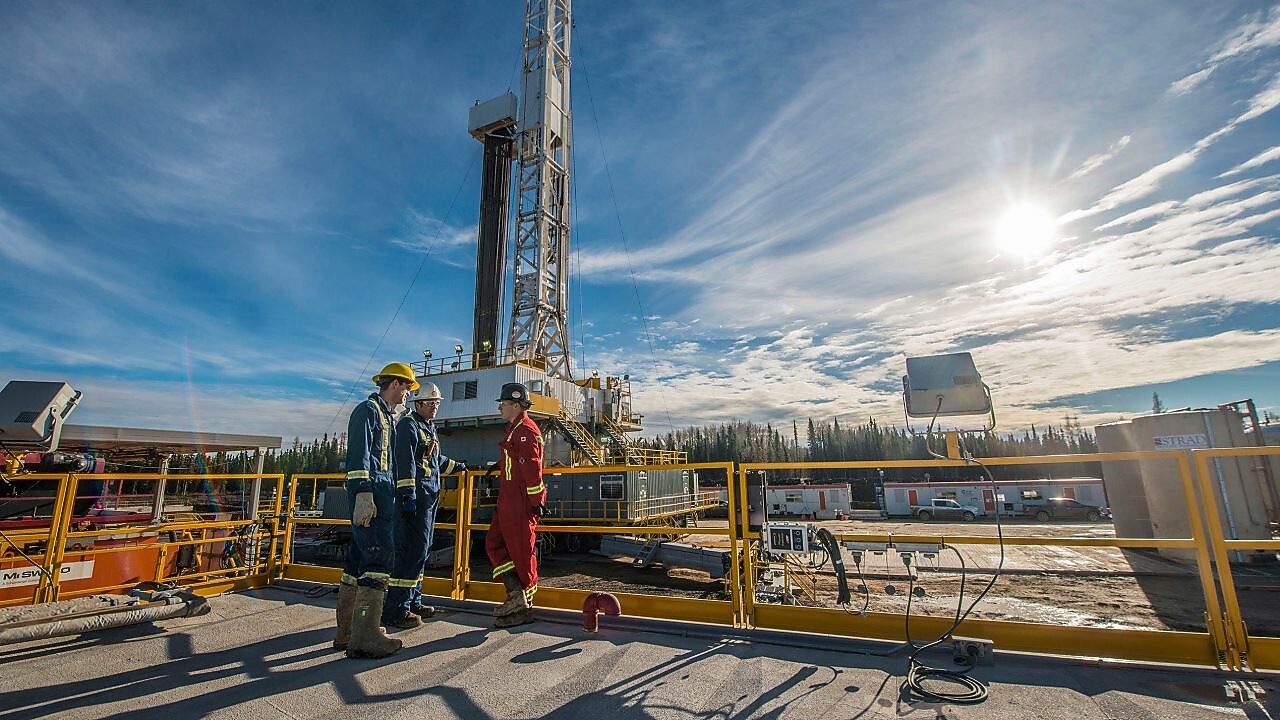 Shell gas processing three shell employee working