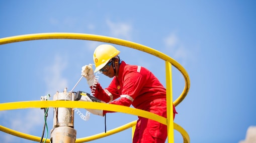Shell employee working on natural gas purification equipment