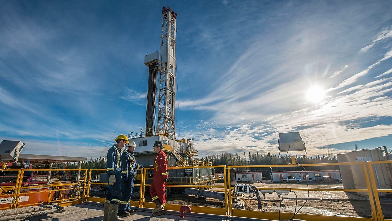Shell gas processing three shell employee working