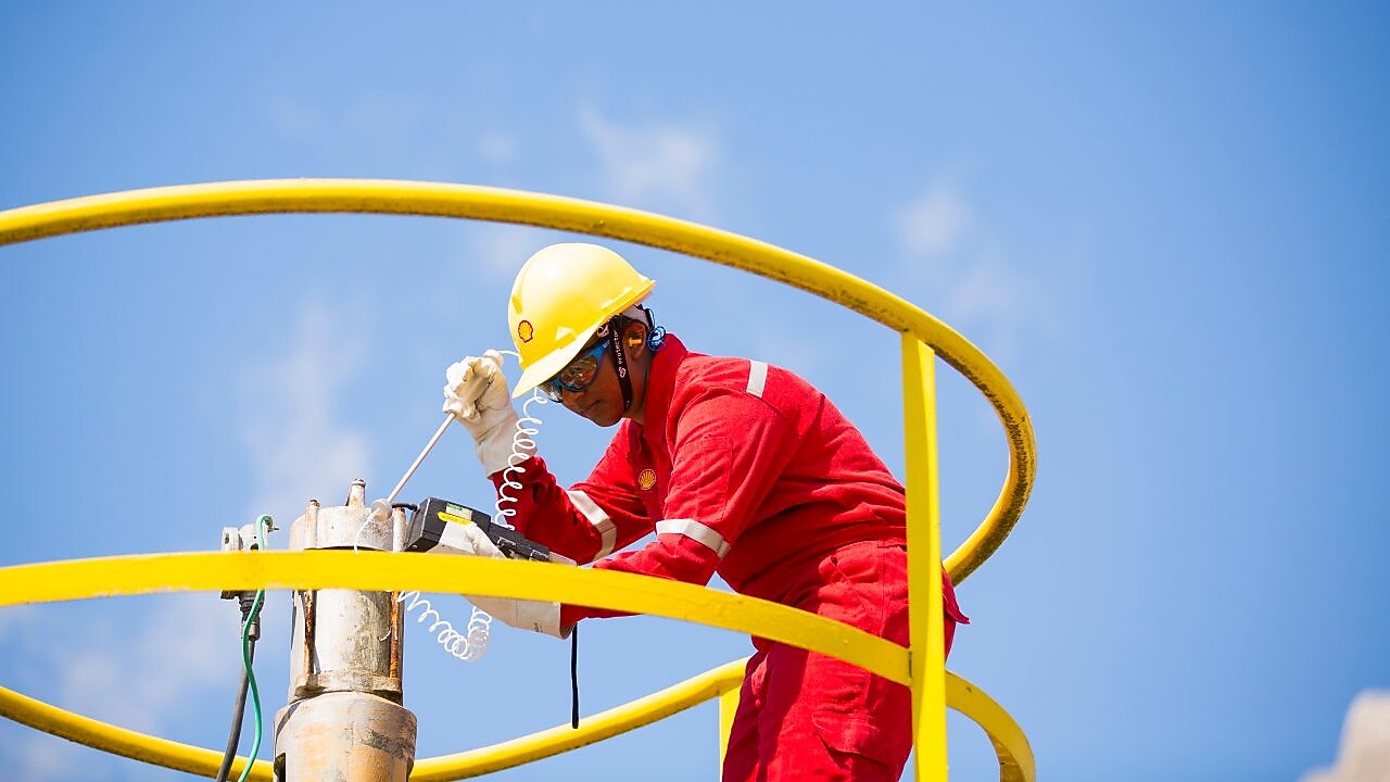 Shell employee working on natural gas purification equipment