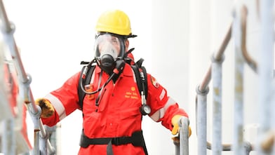Shell Sulfinol Operator on top of Bitumen tank for taking stock