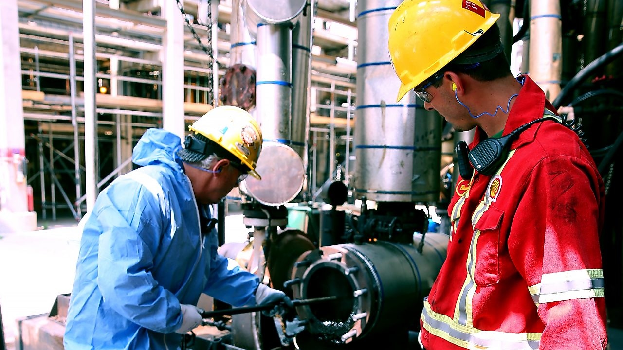 Shell Sarnia workers clean a suction screen used in residue upgrading