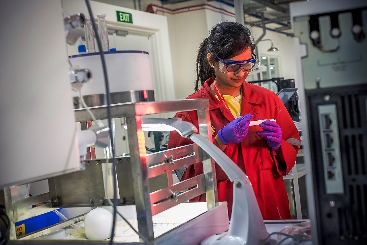 A Shell employee maintains an FCC unit.