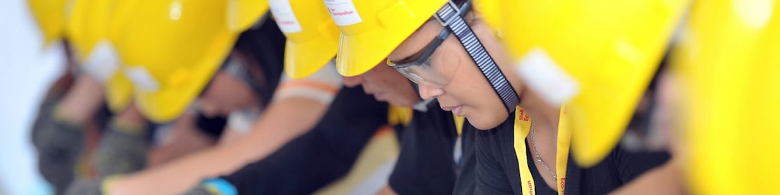 Shell employees working on FCC Internals equipment