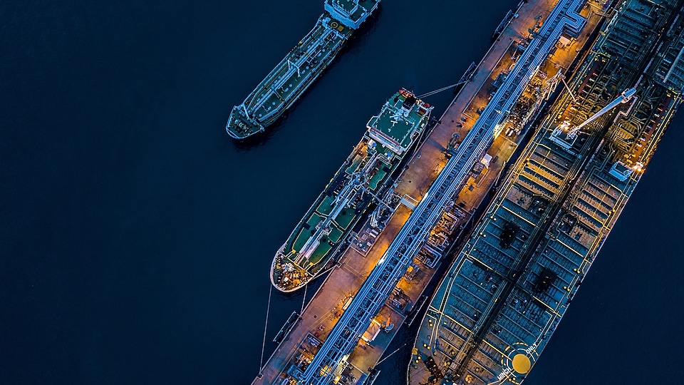 A cargo ship docked from a birds eye view