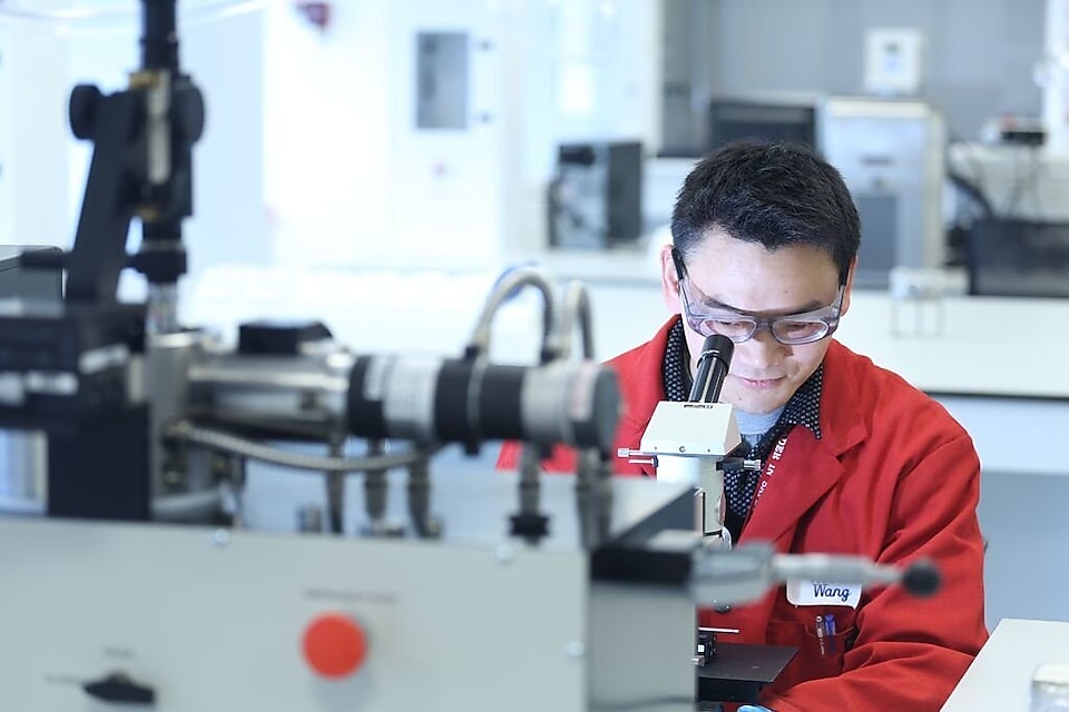 Shell employee examines results of a  carbon dioxide purification process.