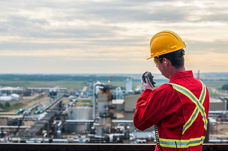 Sulphur recovery engineer overlooks the Shell plant near Alberta