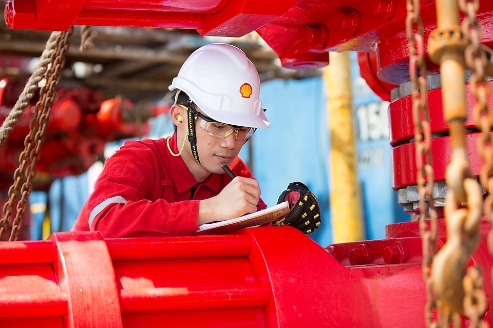 Engineer on board the offshore platform, carrying out maintenance checks
