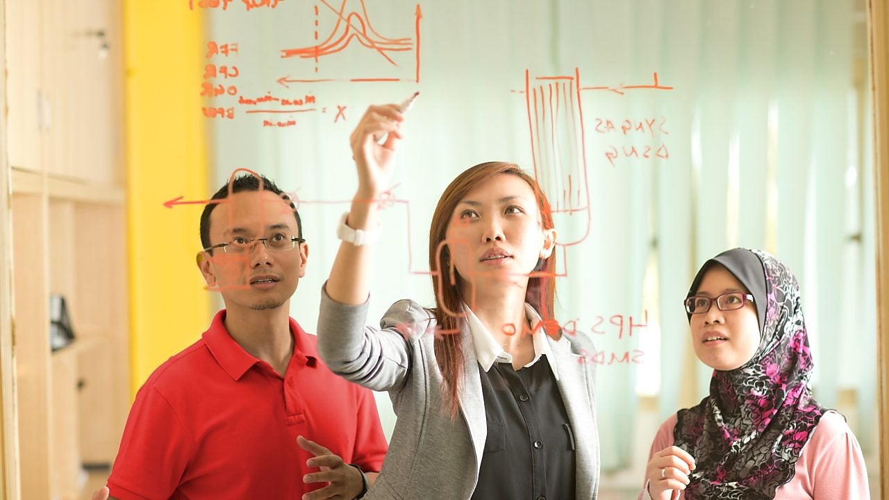 businesswoman writing on glass malaysia