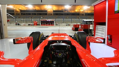 scuderia ferrari car in garage