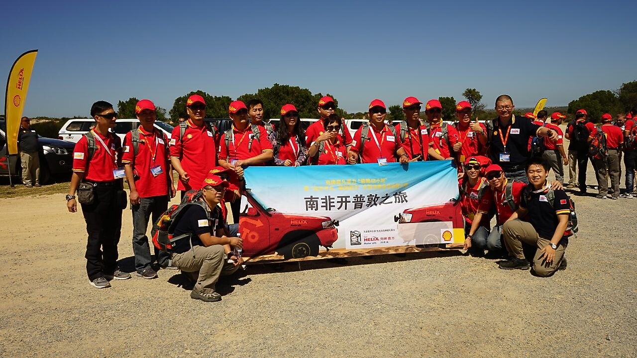 Group of people holding Shell Campaign banner