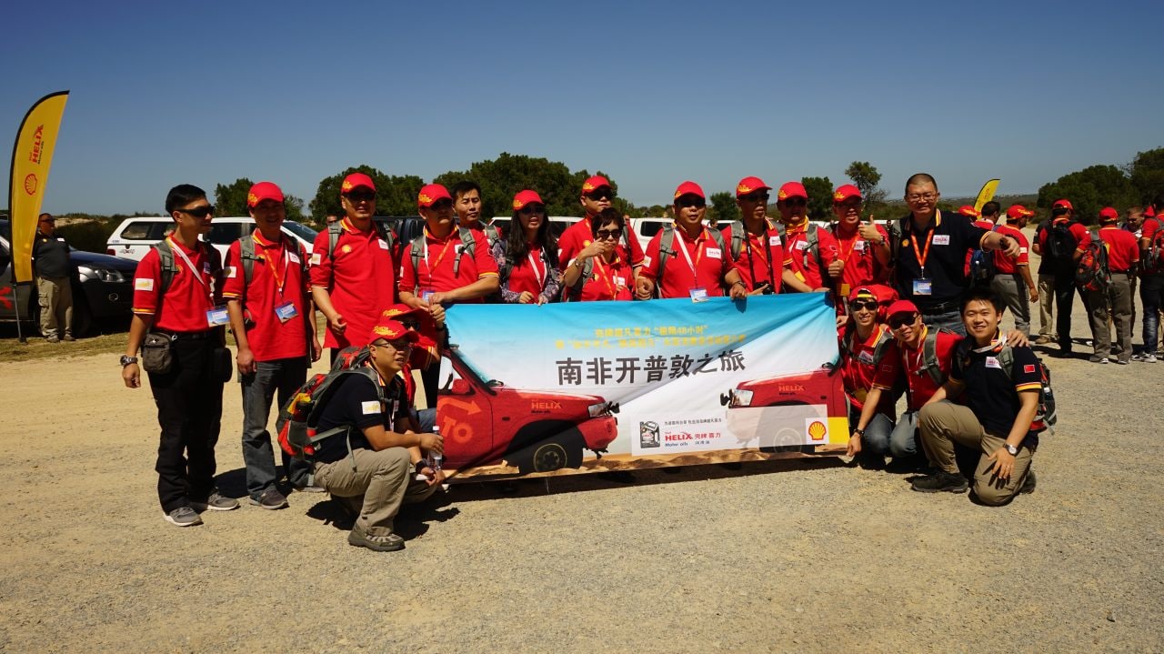 Group of people holding Shell Campaign banner