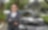 Chen Peng at standing in front of car