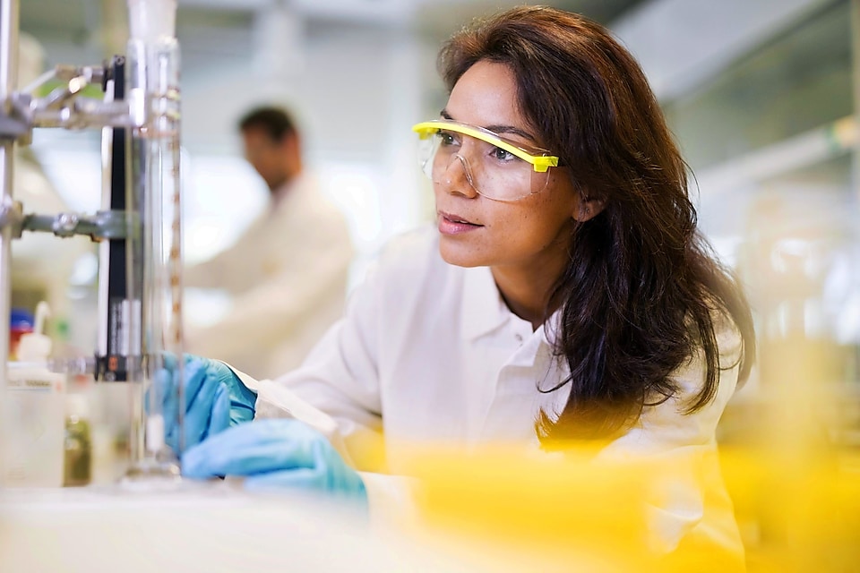 Petrochemical catalyst analyst working inside a lab.